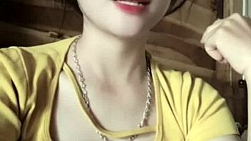 Vietnamese girl dances sexily to music in casual setting