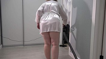 a home camera watches a mature housewife with a thick ass under a short robe and big boobs chubby milf behind the scenes pawg