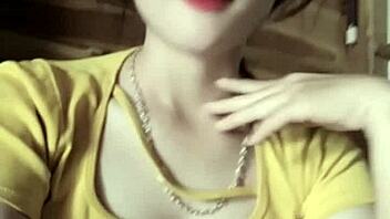 Vietnamese girl dances sexily to music in casual setting