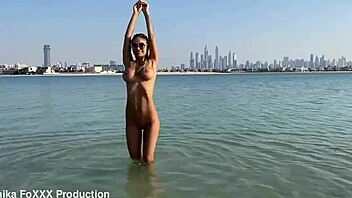 Monika Fox SWIMS NAKED in SEA and WALKS along BEACH
