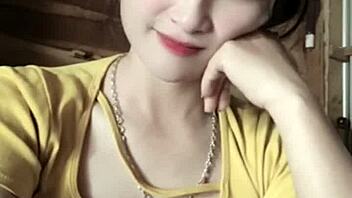 Vietnamese girl dances sexily to music in casual setting