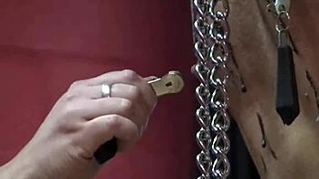 nipple torture for slave with clamps and wax, then pissed on