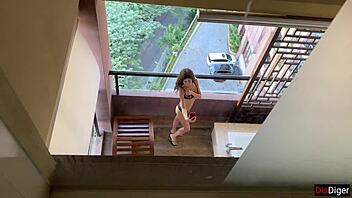 I peep on horny neighbor masturbating on balcony