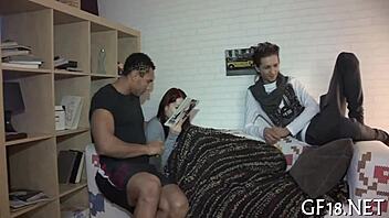 Man sits and stares intently.