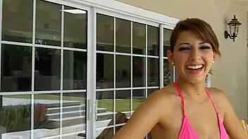 Lexi Bloom participates in pool activity with friends