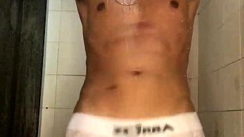 The young guy with a thick cock jerked off vigorously in the shower during his bath.