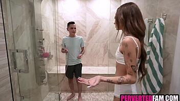 Blonde teen and skinny friend enjoy a steamy shower together with playful bathing fun