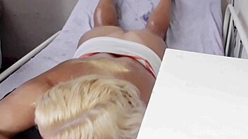 This blonde gets a relaxing massage on her big oiled ass.