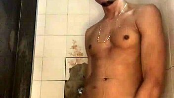 The young guy with a thick cock jerked off vigorously in the shower during his bath.