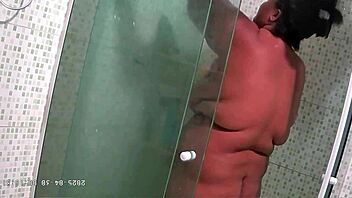 Hidden camera catches chubby milf with big natural tits and ass taking steamy shower