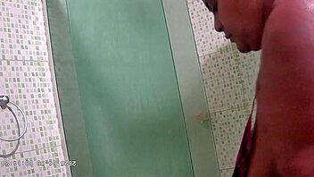 Hidden camera catches chubby milf with big natural tits and ass taking steamy shower