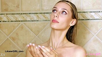 In this scene, the stunning golden-haired model took a relaxing shower on the sofa