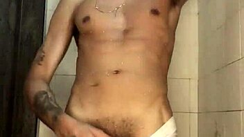The young guy with a thick cock jerked off vigorously in the shower during his bath.