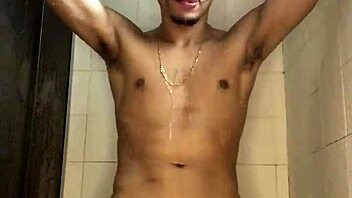 The young guy with a thick cock jerked off vigorously in the shower during his bath.