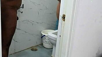 OMG, this lucky asian guy is showering with a busty ebony milf and her huge natural tits!