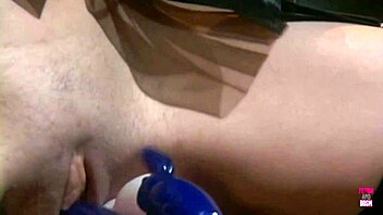 one sexy lesbian lady with fake tits is playing with her smoking hot lesbian friend using dildo toys