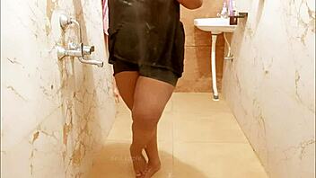 Myanmar milf enjoys a steamy shower, lathering up her curves in a relaxing bath.