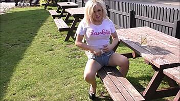 Jessica Morgan boldly dares to visit a pub outdoors while flashing in her public Pampers nappy back in May 2021.