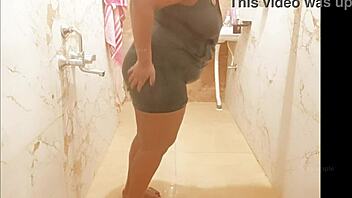 Myanmar milf enjoys a steamy shower, lathering up her curves in a relaxing bath.