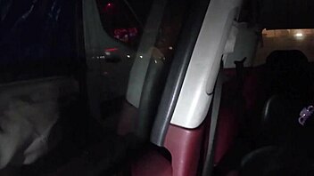The young amateur bends over in doggystyle for an outdoor public POV fuck near the car, leading to a cumshot as the truck driver watches like a voyeur.