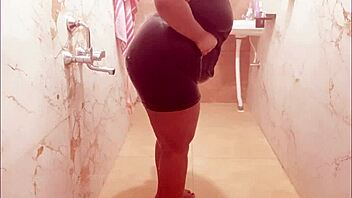 Myanmar milf enjoys a steamy shower, lathering up her curves in a relaxing bath.