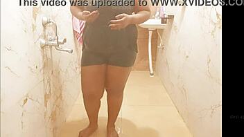 Myanmar milf enjoys a steamy shower, lathering up her curves in a relaxing bath.