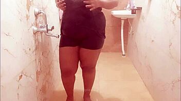 Myanmar milf enjoys a steamy shower, lathering up her curves in a relaxing bath.