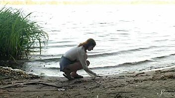 Whoa, how does teen redhead Mia hit such a wild orgasm fingering beside the lake?
