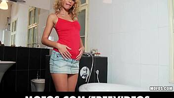 Curly haired blonde bombshell masturbates solo with her wet panties