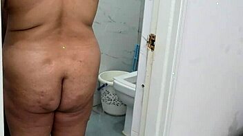 OMG, this lucky asian guy is showering with a busty ebony milf and her huge natural tits!