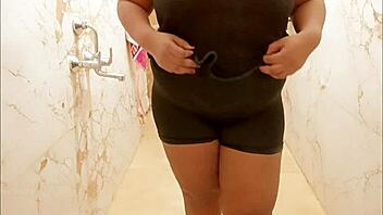 Myanmar milf enjoys a steamy shower, lathering up her curves in a relaxing bath.