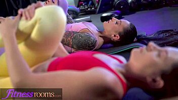 Lexi Dona engages in intense lesbian scissoring and tribbing after a steamy yoga class in the fitness room.