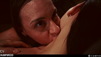 Seductive lesbian vampire Josephine Jackson lures in Rikako Katayama for intense domination and scissoring in Halloween cosplay.