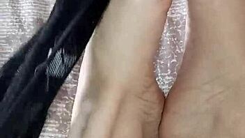 dark-haired gretala contrasts her sensual moves by rubbing thong against bare feet in alternative ebony style