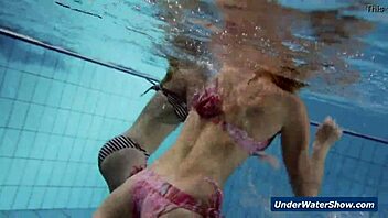 I-I'm watching these horny girls strip each other in the pool, so hot