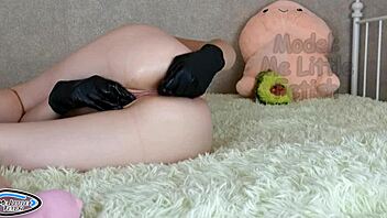 A skinny college student in latex gloves uses a butt plug for close-up solo play