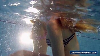 I-I'm watching these horny girls strip each other in the pool, so hot