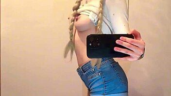 Hey, cute college girl films herself in the mirror and gets super horny