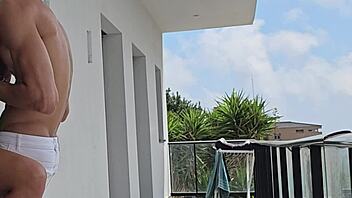 Tommy Cabrio and I got passionate on the balcony with neighbors watching our muscular outdoor fuck