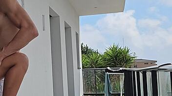 Tommy Cabrio and I got passionate on the balcony with neighbors watching our muscular outdoor fuck