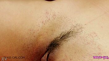 In a cozy sofa setting, a beautiful brunette teen 18+ enjoys a relaxing massage session during her casting interview.