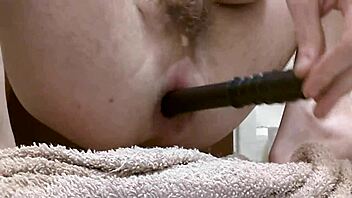 in a relaxed story, she masturbates her wet ass using a toy and fingers for pleasure