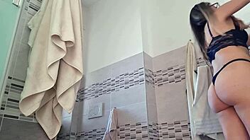 Attractive latina woman tidies up her home while wearing comfortable panties for a relaxed day