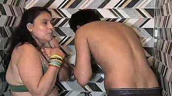 Muscular housewife with big ass and tits gives deepthroat blowjob in bathroom, then dances and fingers for cum in mouth with husband.