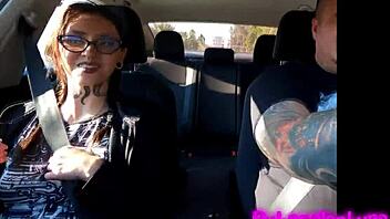 Tattooed brunette cutie gives hot blowjob during casting interview on way to hotel