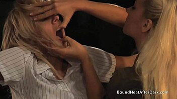 In a intense bdsm scene, hot bound lesbian slaves submit to licking pussy under merciless mistress domination.