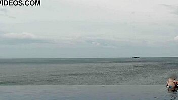 Chatting about relaxing by the infinity pool with scenic views