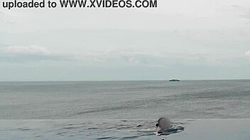 Chatting about relaxing by the infinity pool with scenic views