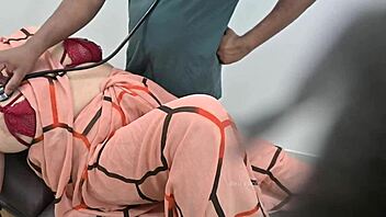 Indian doctor examines lady patient thoroughly in the clinic setting