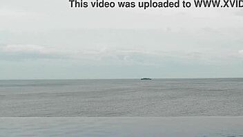 Chatting about relaxing by the infinity pool with scenic views